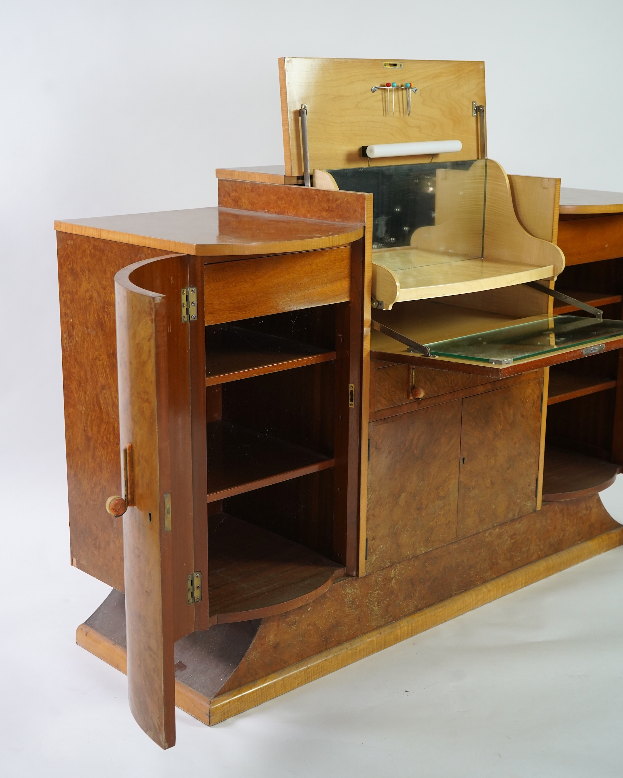 Attributed to Harry and Lou Epstein: An Art Deco burr walnut dining suite